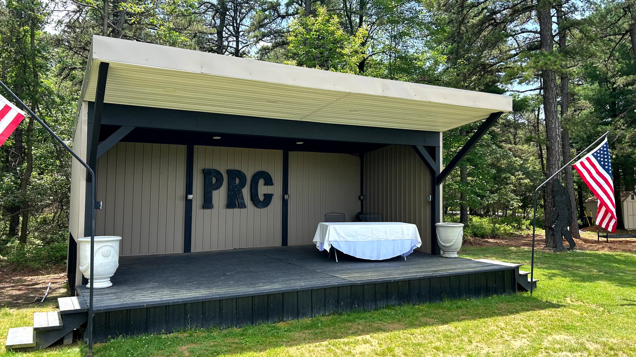 PRC Stage outdoor entertainment venue with American flags