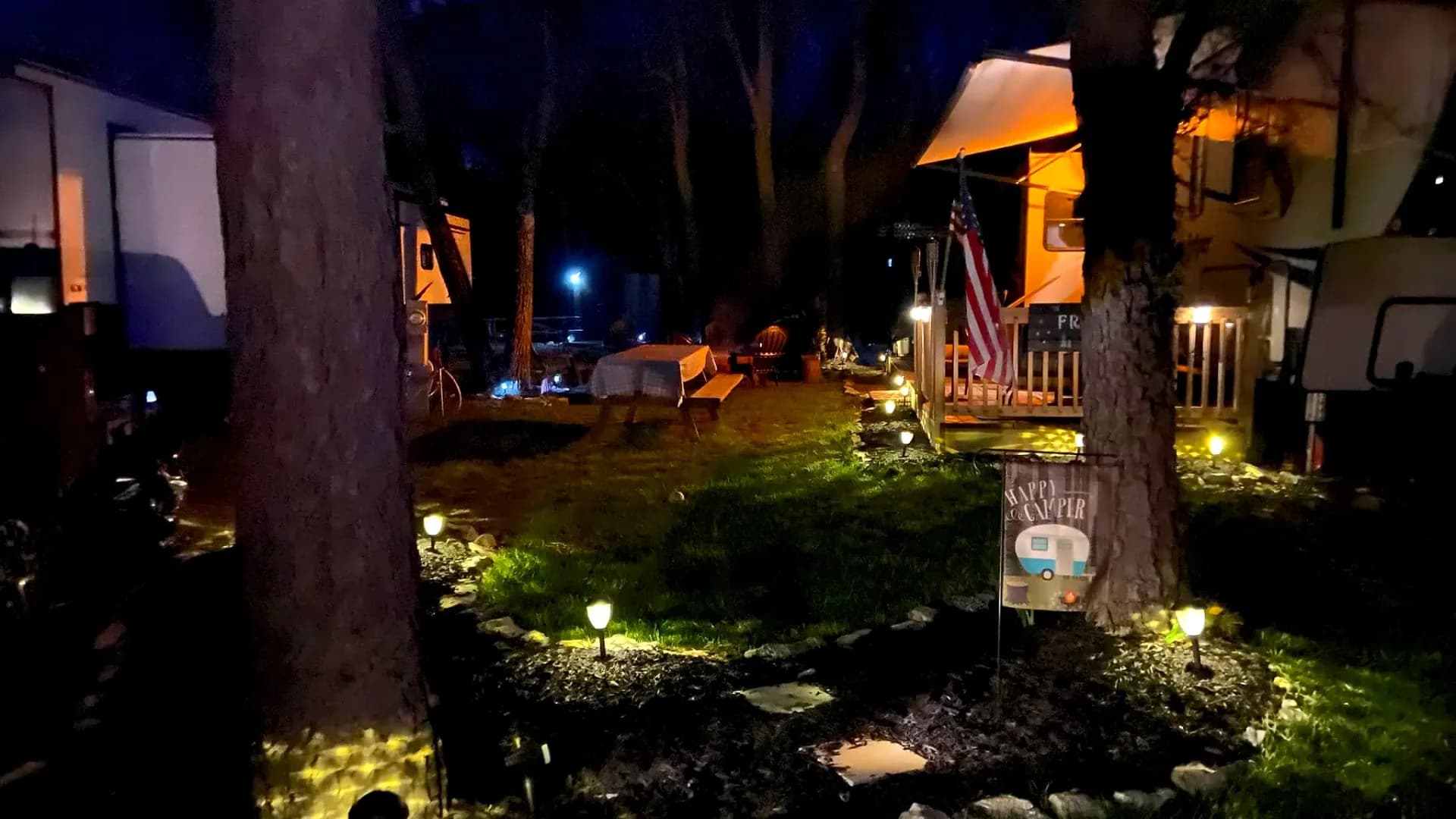 Decorated site with pathway lights at night