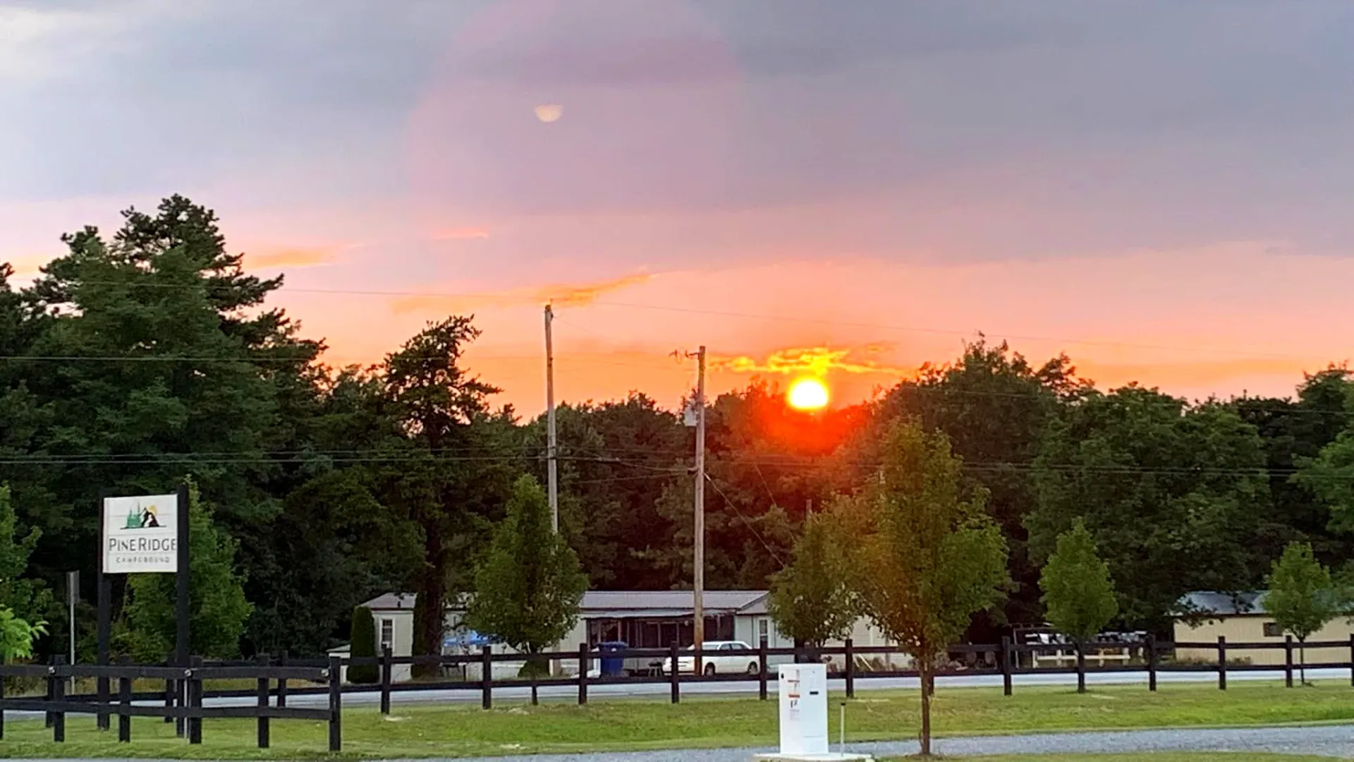 Pine Ridge entrance sign at sunset