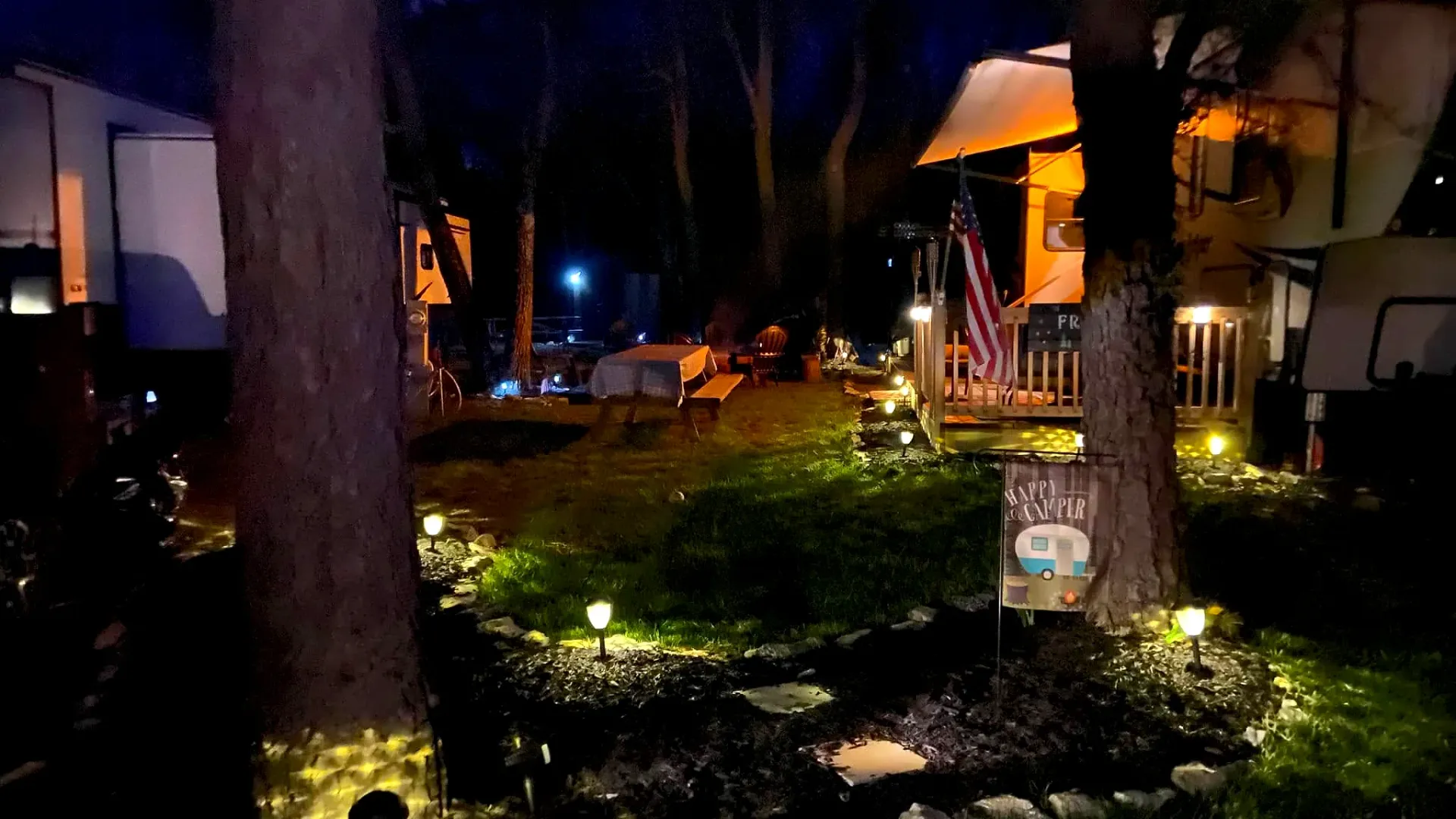 Decorated site with pathway lights at night